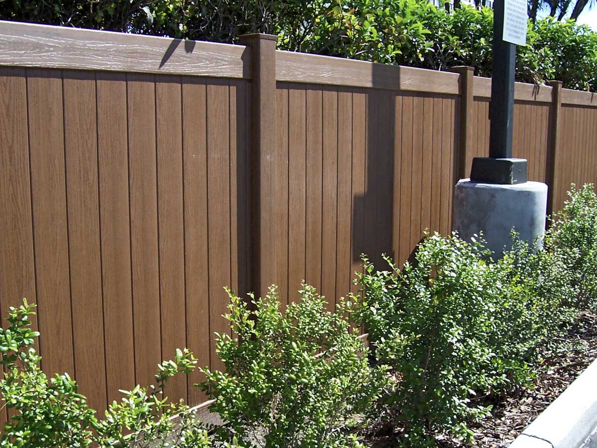 Wood-Grain Vinyl Privacy Fence Installed at Commercial Property Line - Maintenance-Free Option in Westland, MI