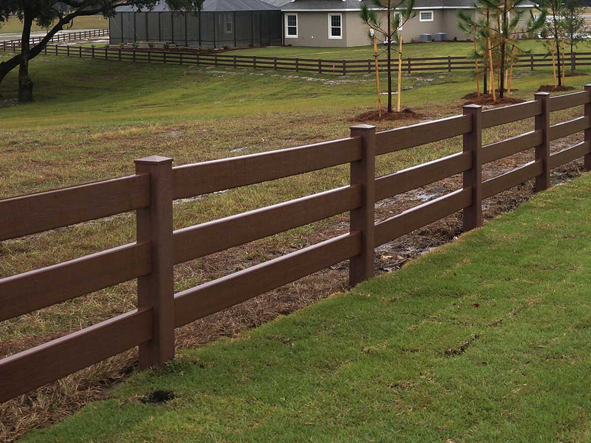 Three-Rail Ranch-Style Vinyl Fence in Wood Tone - Ideal for Large Residential Properties in Westland, MI